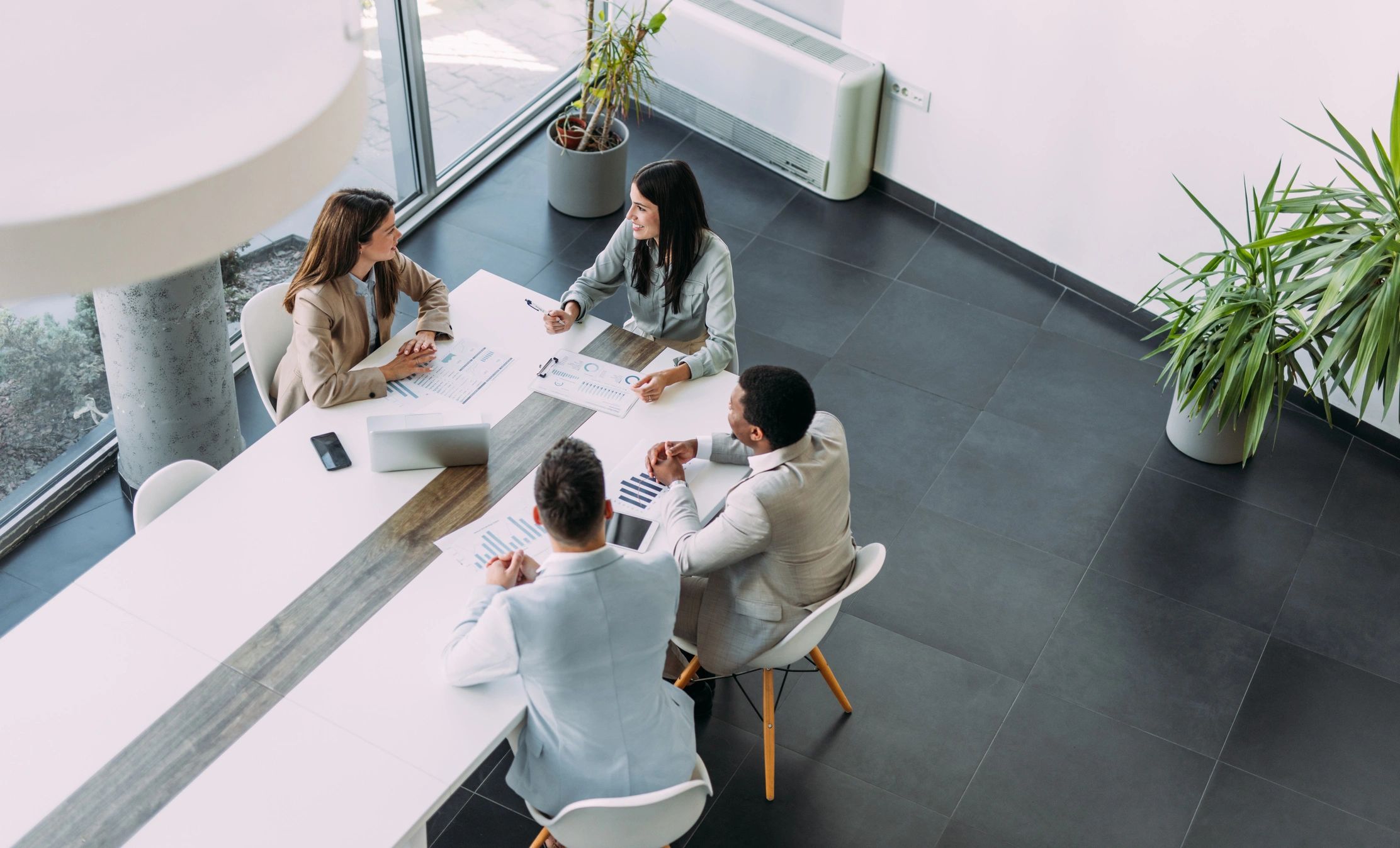 Business and technology team meeting around a conference table